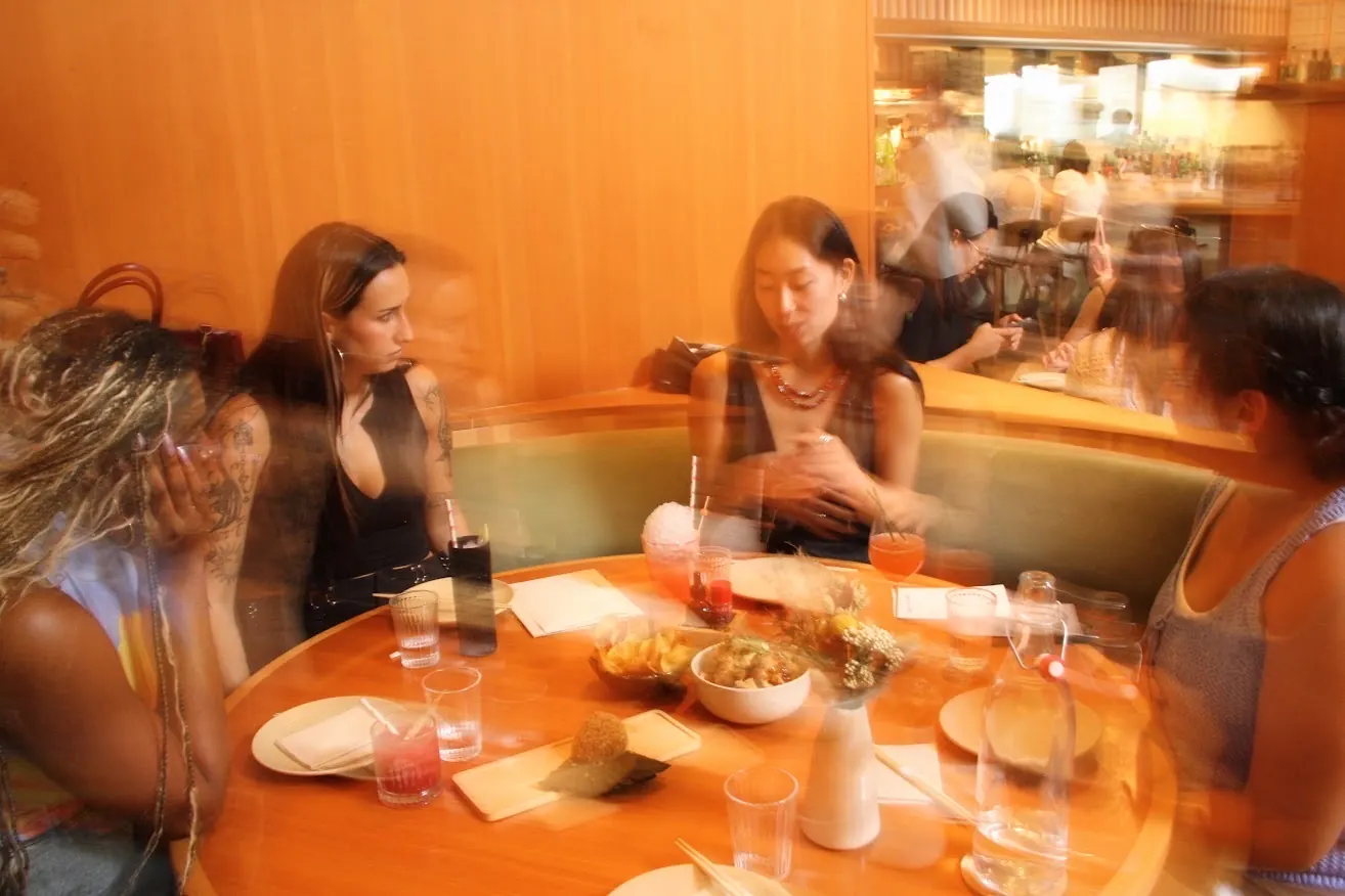 a candid booth of guests mid-conversation